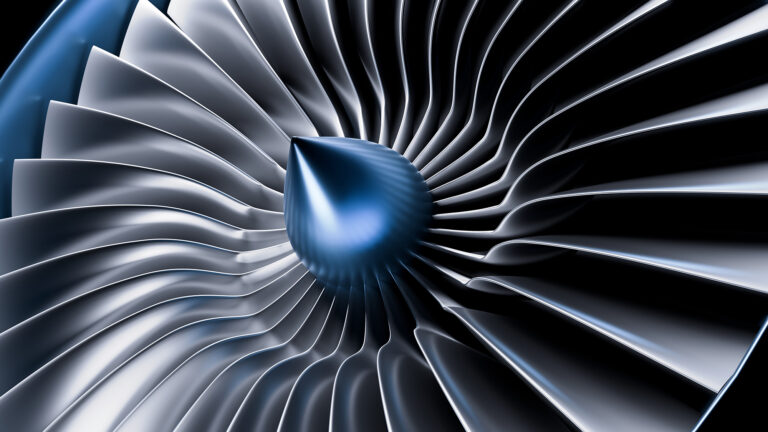 Nahaufnahme einer Turbine mit schaufelartigen Strukturen in blauen und silbernen Tönen.
